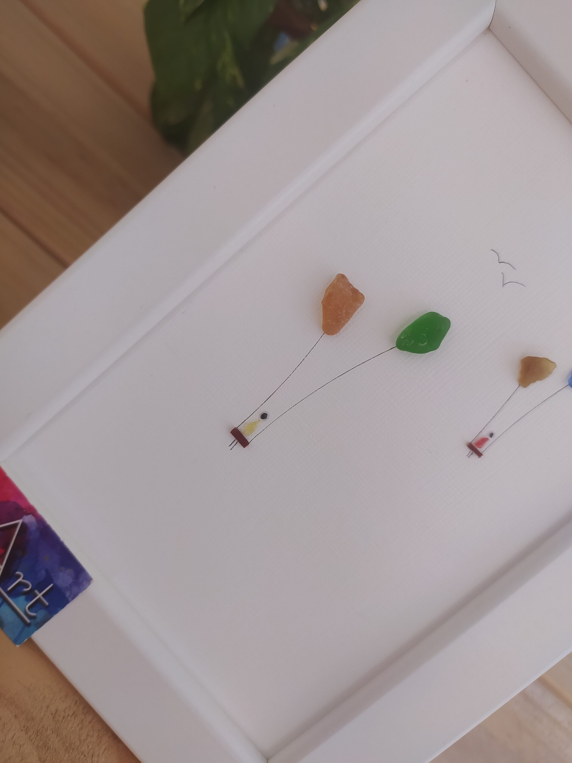 detail sea glass balloons and two swings